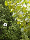 White Birdhouse On A Pole