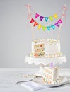 White Birthday Cake colorful bunting