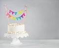 White Birthday Cake colorful bunting