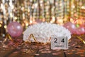 white birthday cake. The wooden calendar shows January 24. Royalty Free Stock Photo