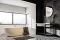 White and black bathroom corner, tub and sink Royalty Free Stock Photo