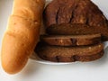 White and black bread on a white plate