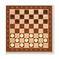 White and black checkers placed on the board Royalty Free Stock Photo
