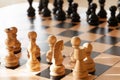 White and black chess pieces on the chessboard, knight, figure, close-up