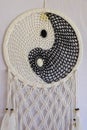 White and black dream catcher Yin Yang. Knitted Indian amulet