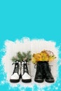 White and black female shoes with winter fir branches and yellow autumn leaves with blue fill for copy space