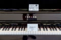 White and black keys in Yamaha electric pianos with a placard do not touch please Royalty Free Stock Photo