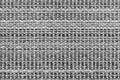 White and black knitted fabric background texture. gray fabric with a pattern. Fragment grey wool carpet, bright wicker dark rug Royalty Free Stock Photo