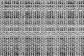 White and black knitted fabric background texture. gray fabric with a pattern. Fragment grey wool carpet, bright wicker dark rug Royalty Free Stock Photo