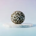 A white and black marble sphere on a marble platform Royalty Free Stock Photo