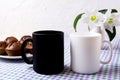 White and black mug mockup with chocolate muffins Royalty Free Stock Photo