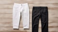 White And Black Pants Mockup On Wooden Surface