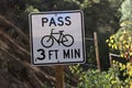 Road sign for cyclists and drivers: Pass 3 ft Minimum. Royalty Free Stock Photo