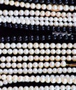 White and black pearls on a black Royalty Free Stock Photo