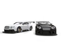 White and black race super cars - side by side