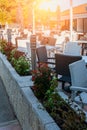 white and black tables and chairs made of wicker plastic in an outdoor cafe. During the Covid 19 pandemic, cafe verandas Royalty Free Stock Photo