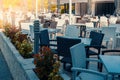 white and black tables and chairs made of wicker plastic in an outdoor cafe. During the Covid 19 pandemic, cafe verandas Royalty Free Stock Photo