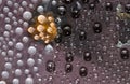 White, black and transparent spheres are located on a brown background with flame hole Royalty Free Stock Photo