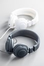 White and black wired stereo headphones on gray background Royalty Free Stock Photo