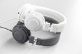 White and black wired stereo headphones on gray background Royalty Free Stock Photo