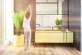 White and black wood bathroom yellow tub and girl