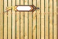 White Blank Arrow Pointer On The Wooden Fence