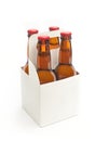 A white blank beer packaging with four brown beer bottles Royalty Free Stock Photo