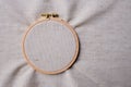 White blank canvas on wooden round frame as a background. Flat lay top view