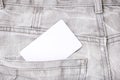 A white blank card in a dark gray worn jeans pocket for text, copy space Royalty Free Stock Photo