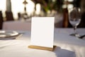 White blank card mockup for Menu or greeting, invitation on wedding table setting background Royalty Free Stock Photo