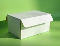 White blank cardboard box sits on vibrant green surface. Casts clear shadow. Empty package ready for custom branding product Royalty Free Stock Photo