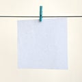 White blank cards on rope, light wall background. Creative remin Royalty Free Stock Photo