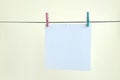 White blank cards on rope, light wall background. Creative remin Royalty Free Stock Photo