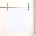 White blank cards on rope, light wall background. Creative remin Royalty Free Stock Photo