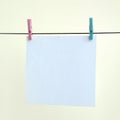 White blank cards on rope, light wall background. Creative remin Royalty Free Stock Photo