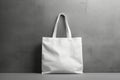 White blank cotton eco tote bag, design mockup Shopping bag hanging on wall Royalty Free Stock Photo