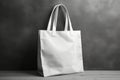 White blank cotton eco tote bag, design mockup Shopping bag hanging on wall Royalty Free Stock Photo