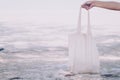 White blank cotton eco tote. Design mockup. Holding blank canvas tote bag, design mockup Royalty Free Stock Photo