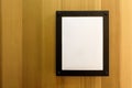 White blank empty brown photo Frame on wooden wall. Background, Wallpaper. Royalty Free Stock Photo