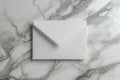 White blank envelope on gray marble table background. Top view