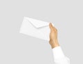 White blank envelope mock up holding in hand. Empty post documen Royalty Free Stock Photo