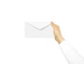 White blank envelope mock up holding in hand. Empty post documen Royalty Free Stock Photo