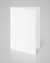 White blank folded flyer on gray Royalty Free Stock Photo