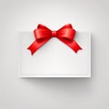 White Blank gift greeting card ticket with bright red ribbon bow with copy space for merry Christmas and Valentine day banner. Royalty Free Stock Photo