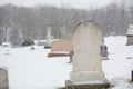 White Blank Grave Stone in Cemetery During Snowfall Royalty Free Stock Photo