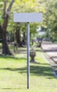 White blank guidepost in the garden Royalty Free Stock Photo