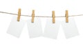 Blank white papers hanging on rope isolated on