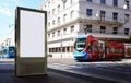 white blank lightbox ad panel along sidewalk. outdoor advertising sign panel. streetcar passing by