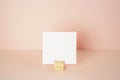 White blank memo pad with wooden holder on pink desk. pink wall background. copy space Royalty Free Stock Photo