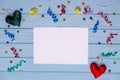 White blank paper with colorful ribbons around and handmade heart Royalty Free Stock Photo